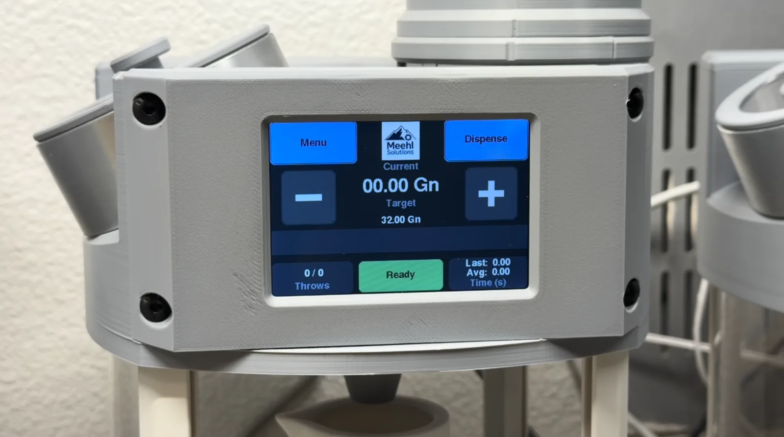 Controller front panel with a color touchscreen showing the dispensing UI: current and target weight in grains, plus-minus controls, a green Ready status, and throw count, mounted on the precision powder-dispensing instrument